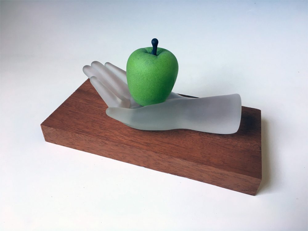 Child-Sized Hand with Green Apple